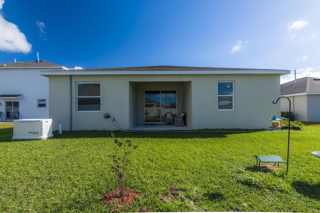 rear view of house with a lawn