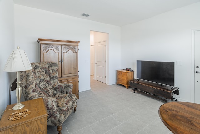 living area with light tile patterned floors