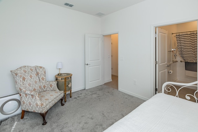 carpeted bedroom with ensuite bathroom