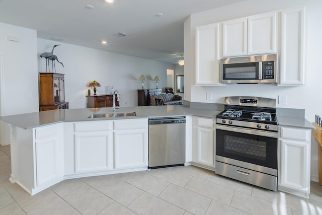 kitchen with white cabinetry, sink, and appliances with stainless steel finishes