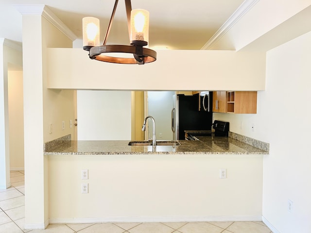 kitchen with pendant lighting, sink, light tile patterned floors, ornamental molding, and black range with electric cooktop