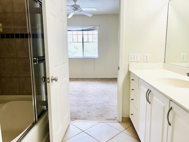 bathroom with tile patterned flooring, vanity, combined bath / shower with glass door, and ceiling fan