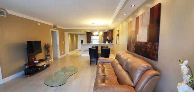 living room featuring ornamental molding and a notable chandelier