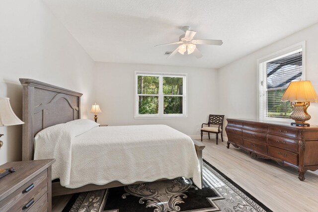 bedroom featuring light hardwood / wood-style floors and ceiling fan