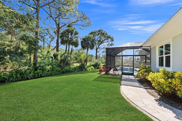 view of yard with glass enclosure