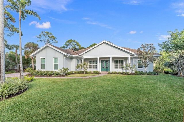 ranch-style home with a front yard