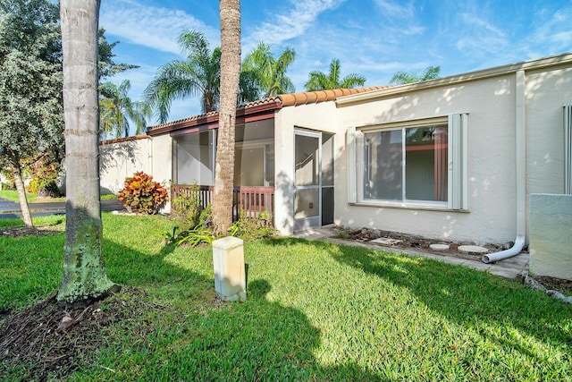 exterior space featuring a front lawn