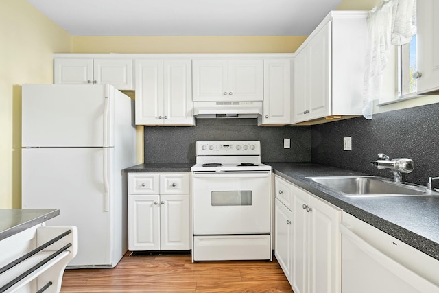 kitchen with white appliances, sink, light hardwood / wood-style flooring, decorative backsplash, and white cabinetry