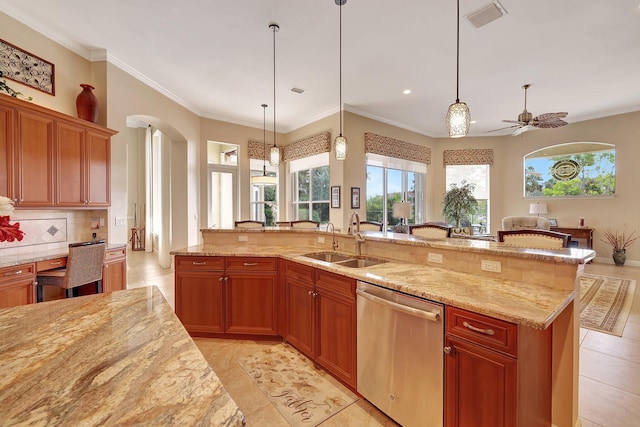 kitchen with arched walkways, visible vents, stainless steel dishwasher, a sink, and light stone countertops