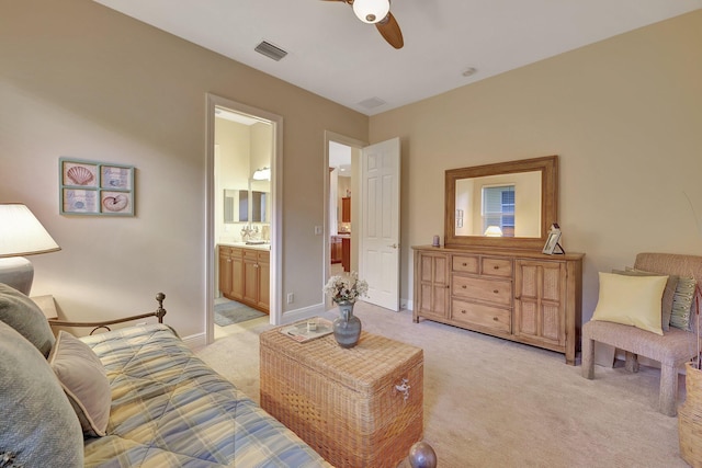 living room featuring light carpet, baseboards, visible vents, and a ceiling fan