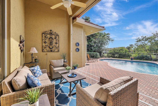 view of swimming pool with a fenced in pool, a ceiling fan, a patio, fence, and an outdoor living space