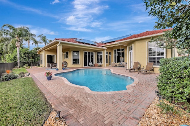 view of swimming pool with a patio, fence, and a fenced in pool