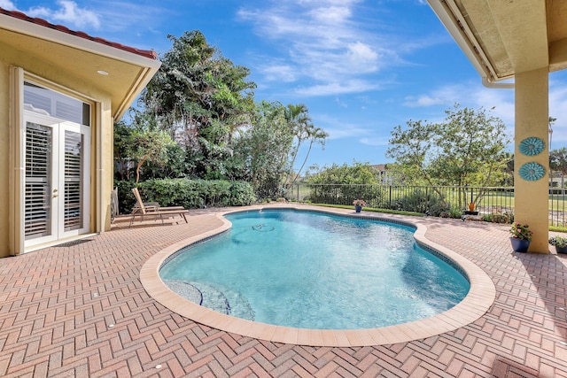 view of pool featuring a fenced in pool, a patio area, and a fenced backyard