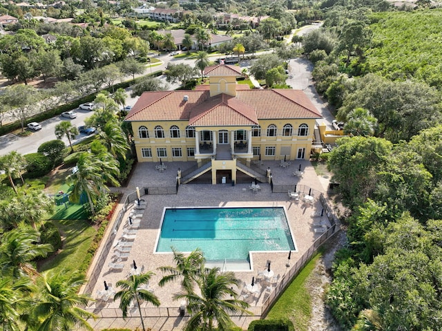 pool featuring a patio area and fence