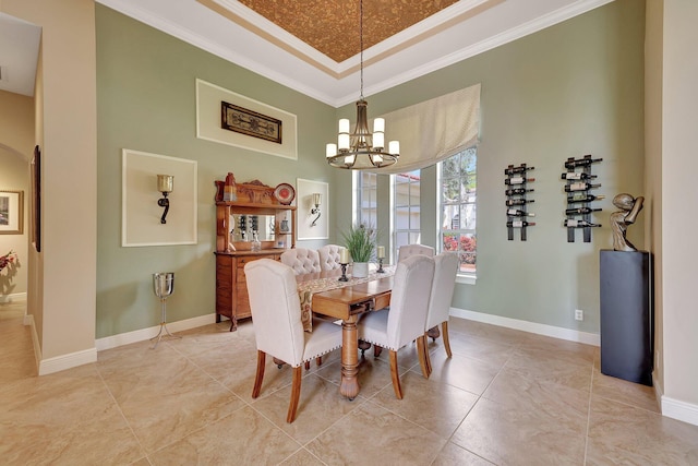 dining area featuring light tile patterned floors, a notable chandelier, baseboards, ornamental molding, and a tray ceiling