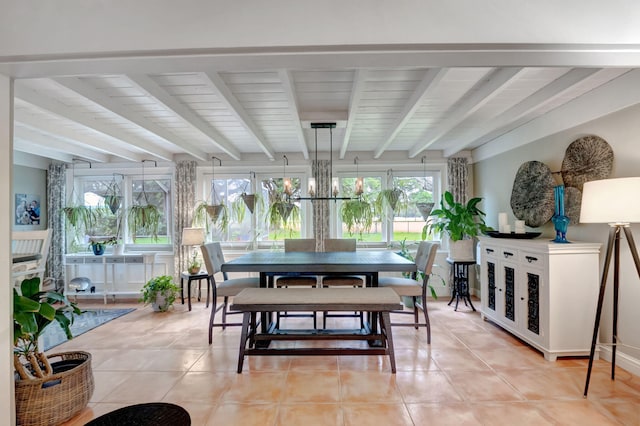 sunroom / solarium featuring beam ceiling and an inviting chandelier