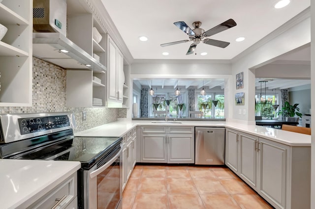 kitchen featuring wall chimney range hood, sink, light tile patterned floors, appliances with stainless steel finishes, and tasteful backsplash