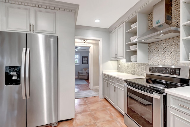 kitchen with white cabinets, wall chimney exhaust hood, backsplash, and stainless steel appliances