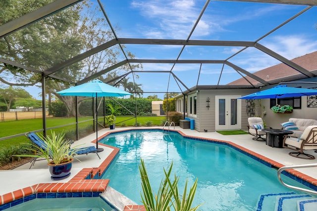 view of pool featuring a patio and glass enclosure