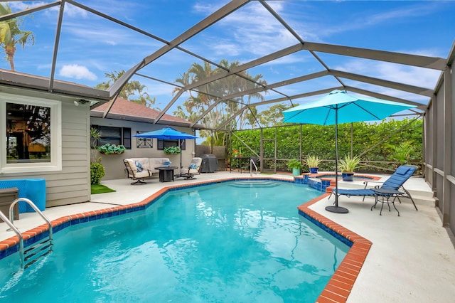 view of pool with an in ground hot tub, a patio, a lanai, and a grill