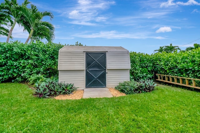 view of outdoor structure with a lawn