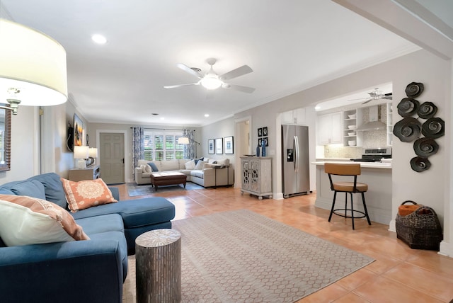 tiled living room featuring crown molding and ceiling fan