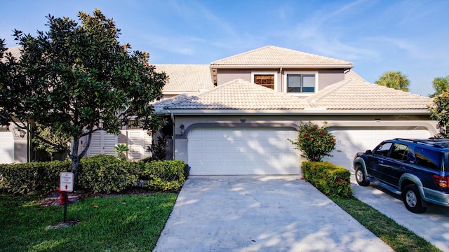 mediterranean / spanish home featuring a garage