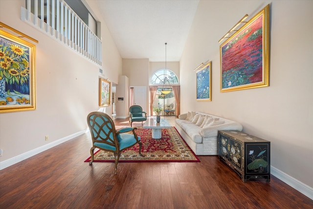 living room featuring dark hardwood / wood-style flooring and high vaulted ceiling