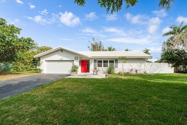 ranch-style house with a front yard and a garage