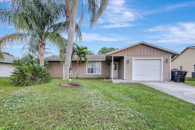 ranch-style home with a front yard and a garage