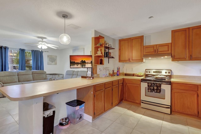 kitchen with hanging light fixtures, light tile patterned floors, a textured ceiling, electric range oven, and kitchen peninsula