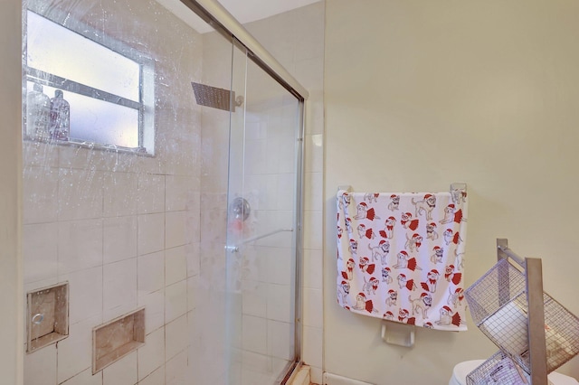 bathroom with toilet and walk in shower