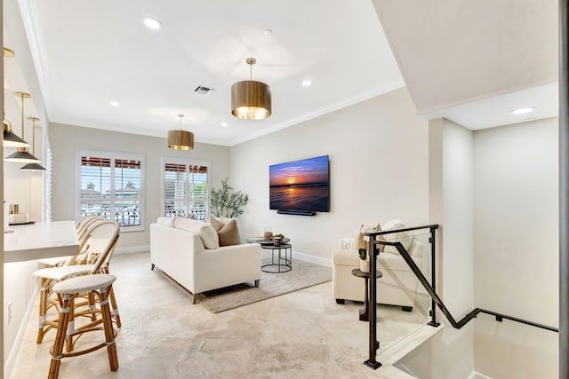 living room featuring crown molding