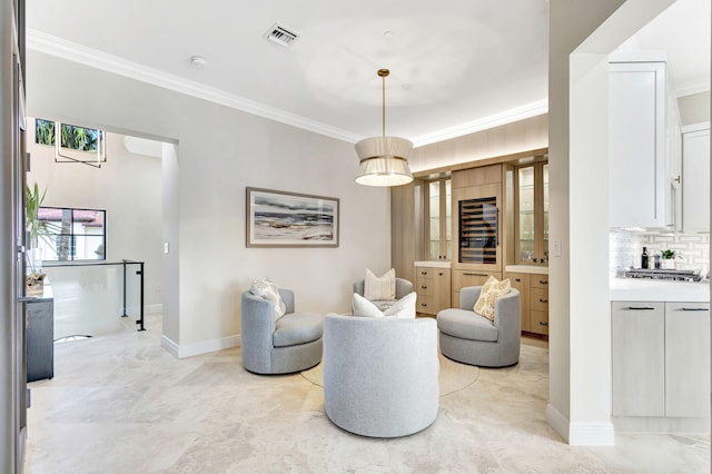 living area featuring wine cooler and ornamental molding