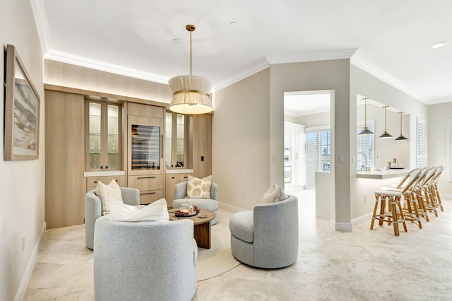 living room with crown molding and sink