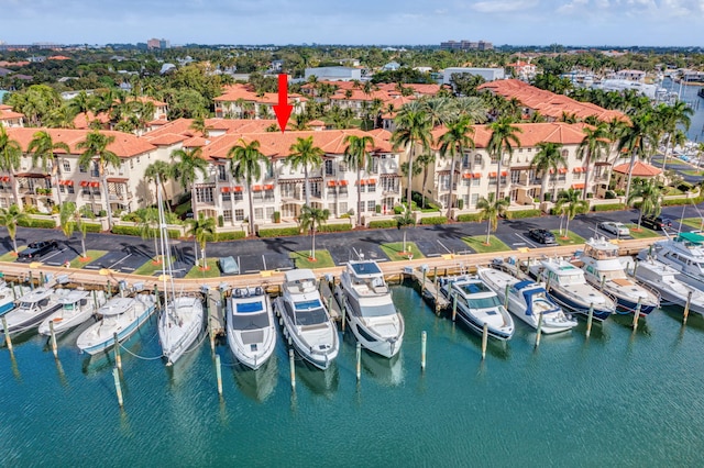 birds eye view of property with a water view