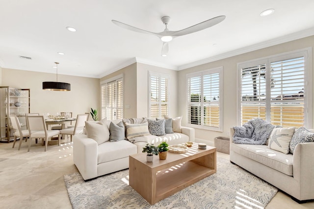 living room featuring ceiling fan and ornamental molding