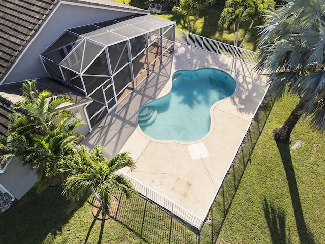 view of swimming pool with a lanai and a patio