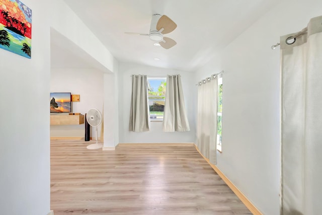 interior space with light hardwood / wood-style floors and lofted ceiling