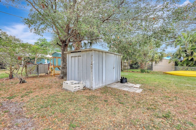 view of outdoor structure with a yard