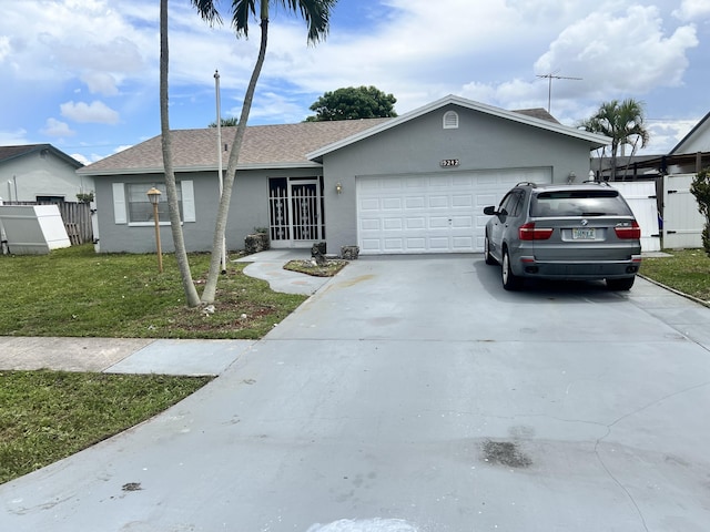 single story home with a front lawn and a garage