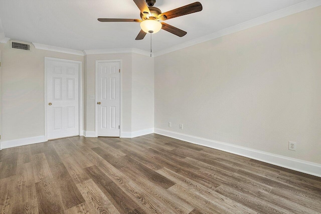 spare room with crown molding, ceiling fan, and wood-type flooring