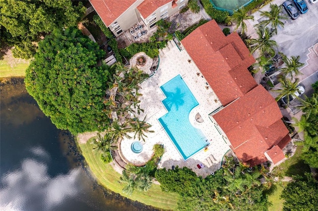 birds eye view of property with a water view