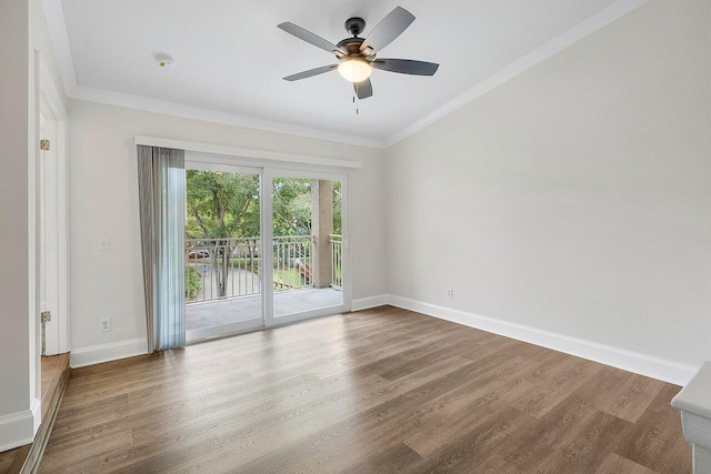 empty room featuring hardwood / wood-style flooring, ceiling fan, and crown molding