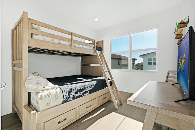 bedroom featuring dark hardwood / wood-style flooring