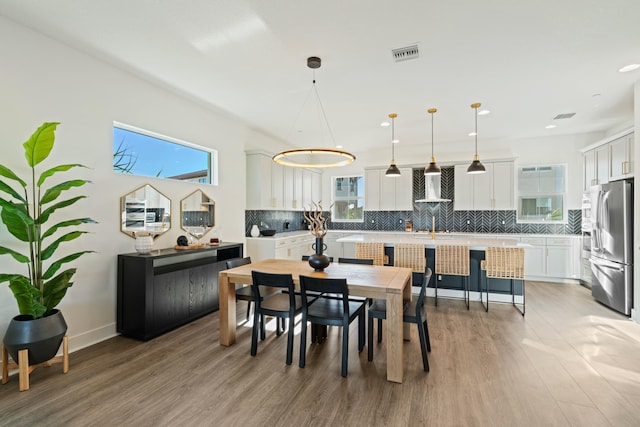 dining area featuring light wood-type flooring