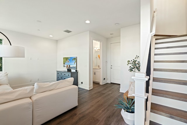 living room with dark hardwood / wood-style flooring