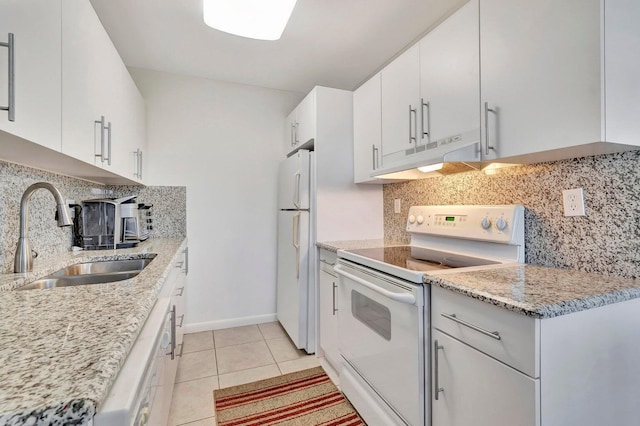 kitchen featuring tasteful backsplash, white appliances, sink, white cabinets, and light tile patterned flooring