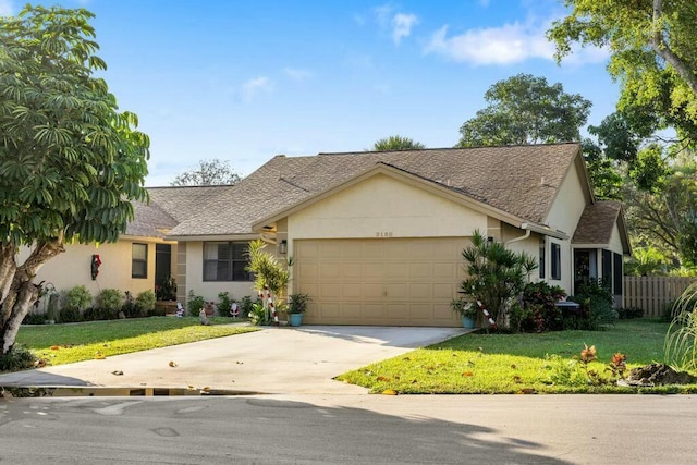 ranch-style house featuring a garage and a front yard