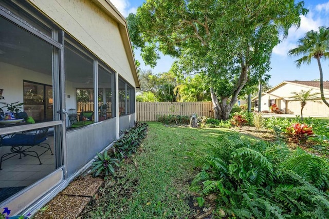 view of yard featuring a sunroom